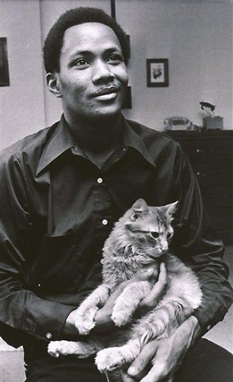 Young Frank Wills holds his cat